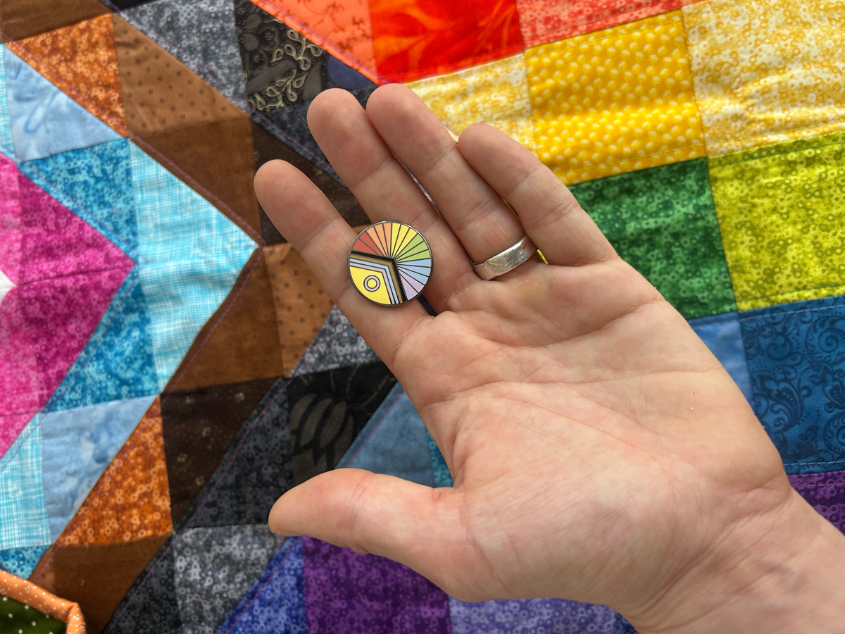 Queer progressive flag enamel pin